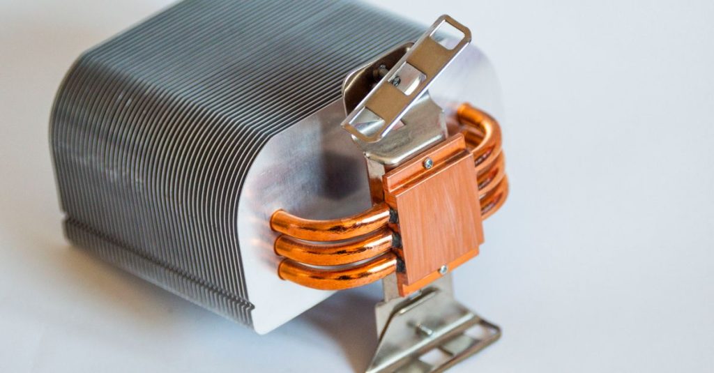 Detailed view of a metallic computer heatsink for cooling systems.