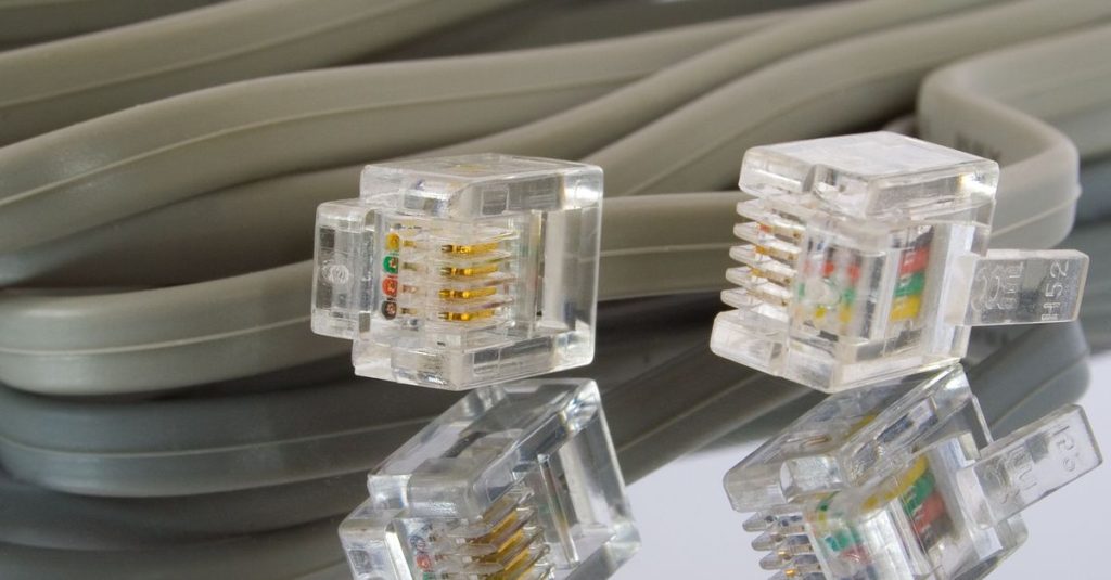 Detailed image of Ethernet cables and connectors, ideal for tech themes.