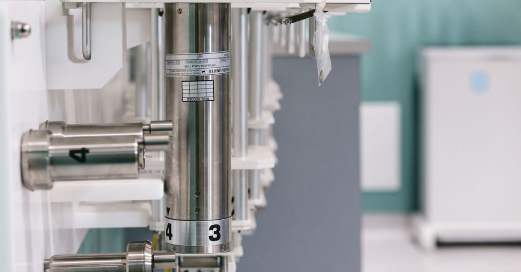 Close-up of metal laboratory apparatus in a sterile research lab environment.