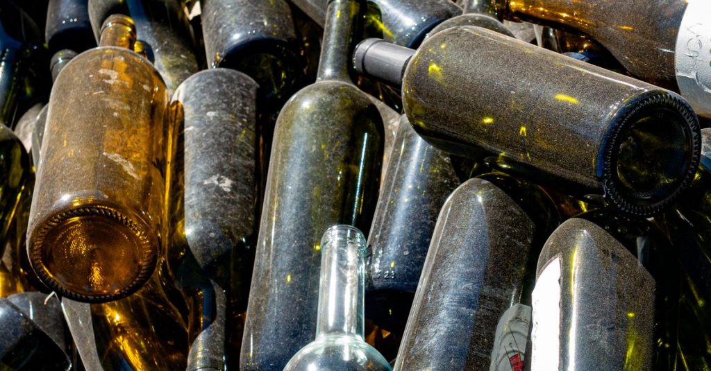 A collection of used glass bottles, showcasing recycling efforts in Mendoza, Argentina.