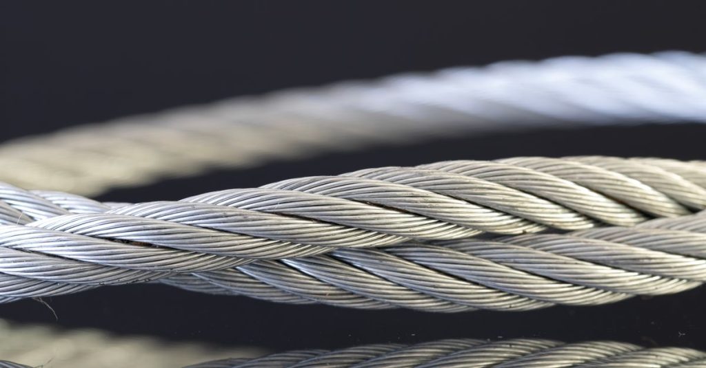 Detailed shot of twisted steel cables showcasing industrial strength and design.