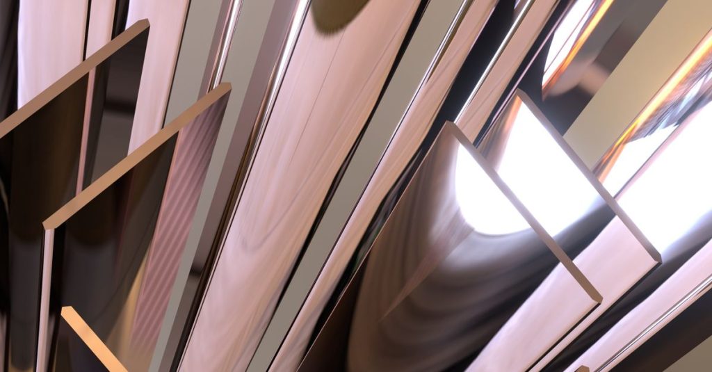 Abstract image featuring metallic reflective panels creating dynamic visual shapes.