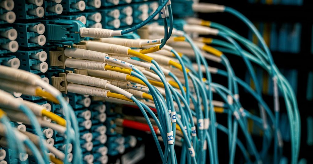 Fiber optical device with similar bright connectors with blue cables made of rubber with plastic pigtails on edges