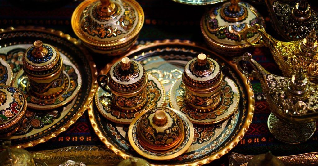 Explore traditional Turkish coffee sets with intricate designs in a Gaziantep bazaar.