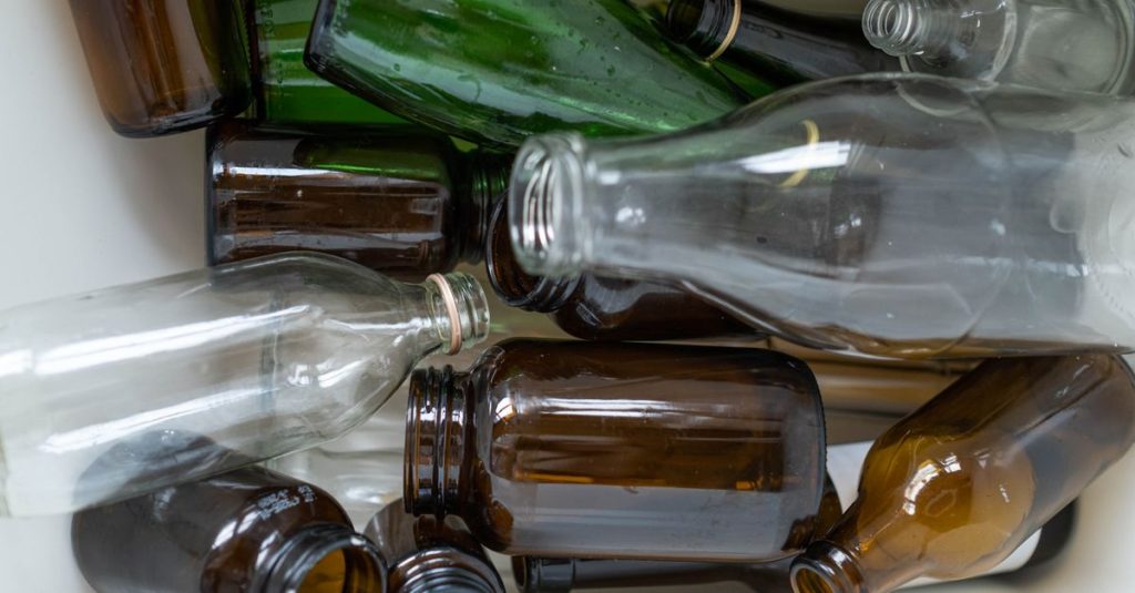 A detailed view of assorted recyclable glass bottles, showcasing their potential for reuse and environmental sustainability.