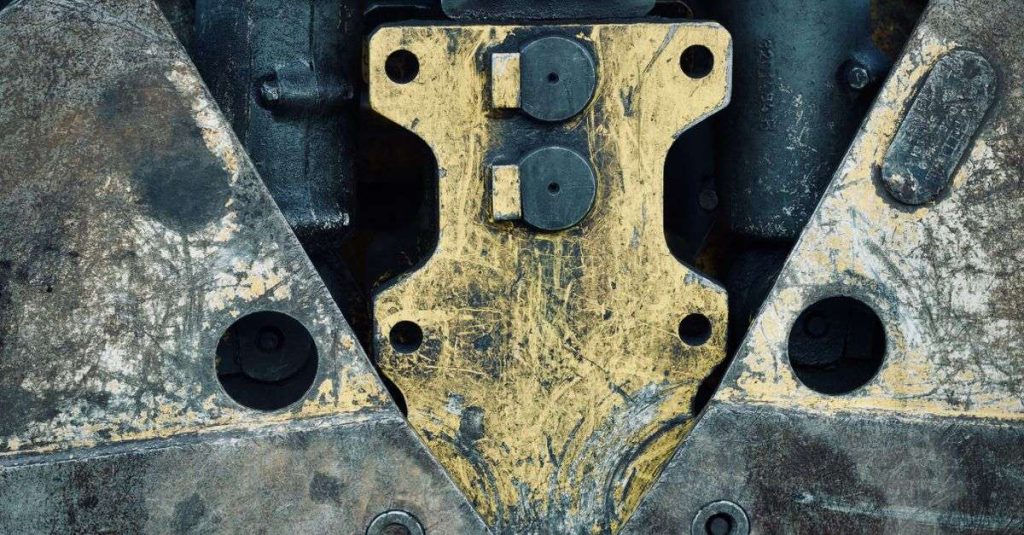 Close-up of aged metal machinery parts showcasing a rugged industrial design.